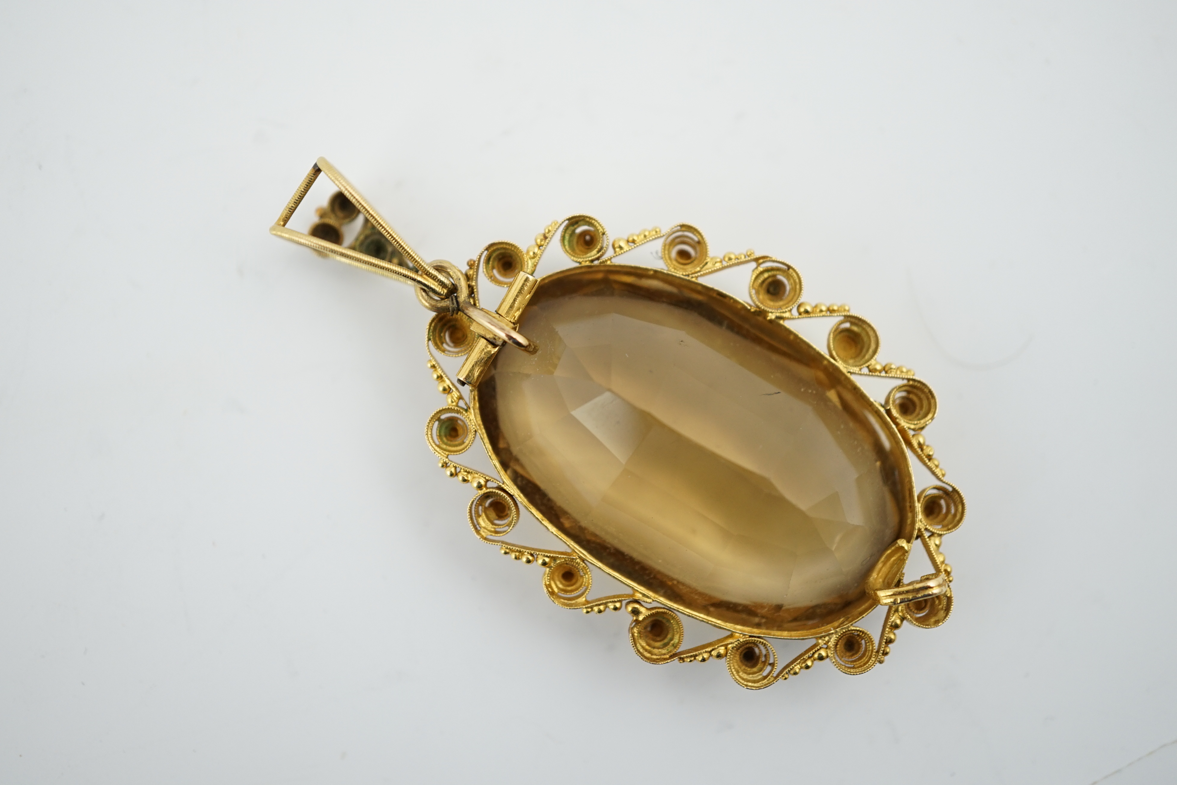 A Victorian style gold and oval cut citrine set pendant